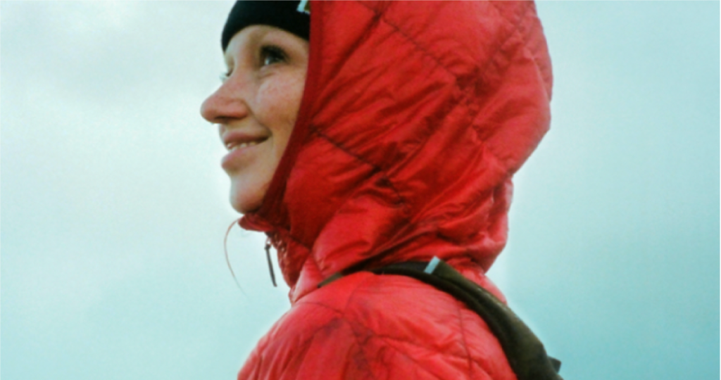 woman in red columbia sportswear raincoat