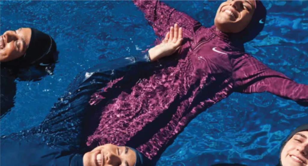 muslim sisterhood in pool wearing nike swim swimwear