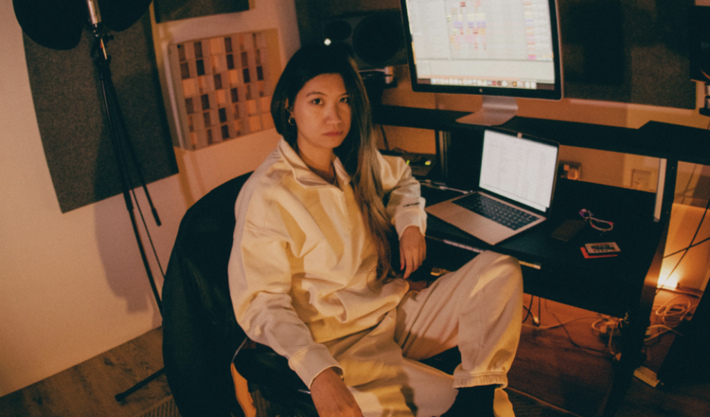 woman dj sitting on chair by desk